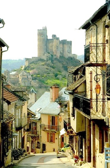 A beautiful mountain village, with a ruined castle at the end of the street, Najac, France